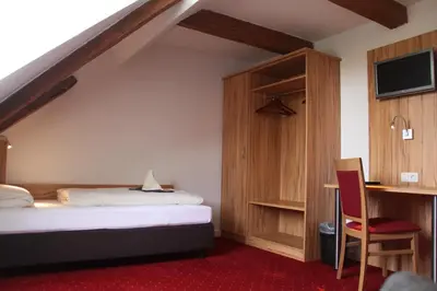 Ein Bett oder Betten in einem Zimmer der Unterkunft Landgasthof Ostermair