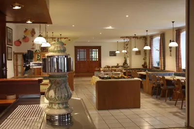 Ein Restaurant oder anderes Speiselokal in der Unterkunft Landgasthof Ostermair