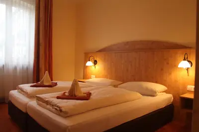 Ein Bett oder Betten in einem Zimmer der Unterkunft Landgasthof Ostermair