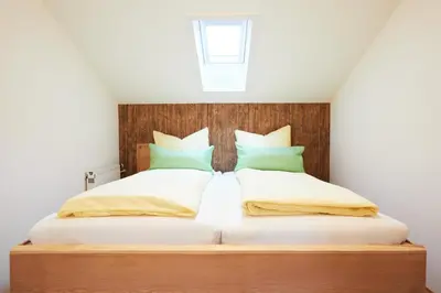 Ein Bett oder Betten in einem Zimmer der Unterkunft Landhaus Lina