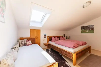 Ein Bett oder Betten in einem Zimmer der Unterkunft Adlerhof