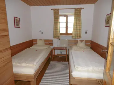 Ein Bett oder Betten in einem Zimmer der Unterkunft Taffenreutherhof