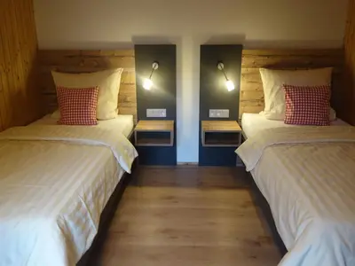 Ein Bett oder Betten in einem Zimmer der Unterkunft Doblerhof