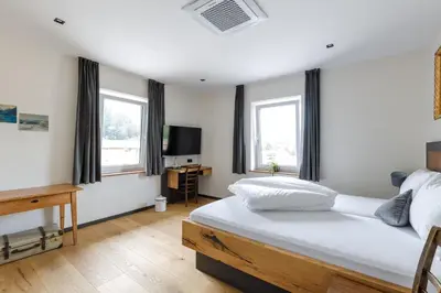 Ein Bett oder Betten in einem Zimmer der Unterkunft Bergwirt Hotel & Gasthof