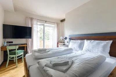 Ein Bett oder Betten in einem Zimmer der Unterkunft Bergwirt Hotel & Gasthof