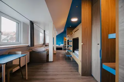Ein Bett oder Betten in einem Zimmer der Unterkunft Jugendherberge München City