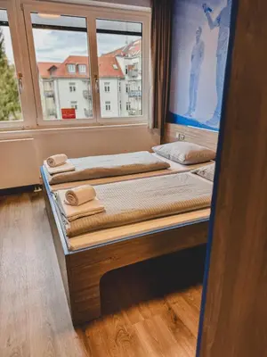 Ein Bett oder Betten in einem Zimmer der Unterkunft Jugendherberge München City
