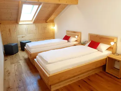 Ein Bett oder Betten in einem Zimmer der Unterkunft Rinser See-Hof