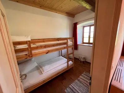 Ein Bett oder Betten in einem Zimmer der Unterkunft Sprenghof