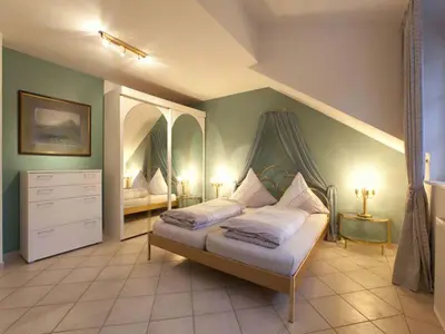 Ein Bett oder Betten in einem Zimmer der Unterkunft Ferienwohnung Linde