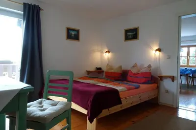 Ein Bett oder Betten in einem Zimmer der Unterkunft Gästehaus Strobl am See