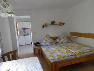 Ein Bett oder Betten in einem Zimmer der Unterkunft Gästehaus Strobl am See