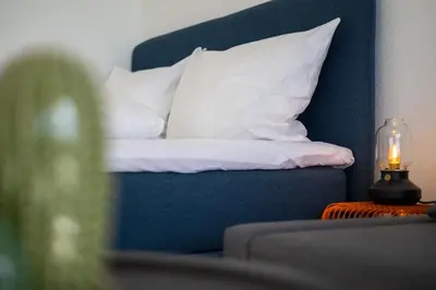 Ein Bett oder Betten in einem Zimmer der Unterkunft Arbio I Balcony Apartments Augsburg