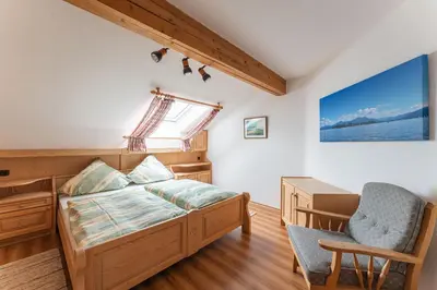 Ein Bett oder Betten in einem Zimmer der Unterkunft Gästehaus Maria