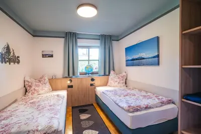 Ein Bett oder Betten in einem Zimmer der Unterkunft Gästehaus Maria