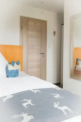 Ein Bett oder Betten in einem Zimmer der Unterkunft Gästehaus Sattlerhof