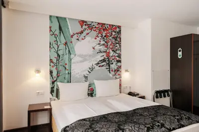 Ein Bett oder Betten in einem Zimmer der Unterkunft Helvetia Rooms - Self Check-In