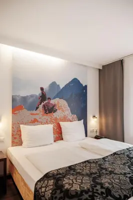 Ein Bett oder Betten in einem Zimmer der Unterkunft Helvetia Rooms - Self Check-In
