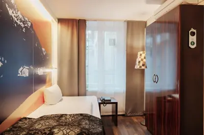 Ein Bett oder Betten in einem Zimmer der Unterkunft Helvetia Rooms - Self Check-In
