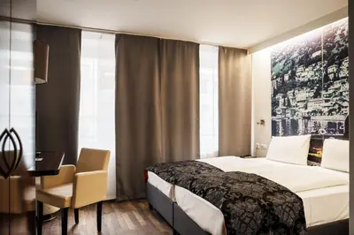Ein Bett oder Betten in einem Zimmer der Unterkunft Helvetia Rooms - Self Check-In