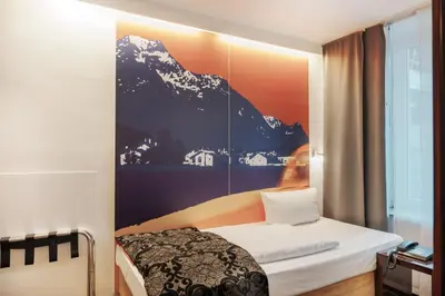 Ein Bett oder Betten in einem Zimmer der Unterkunft Helvetia Rooms - Self Check-In