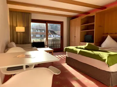 Ein Bett oder Betten in einem Zimmer der Unterkunft Sonnhof Apartments Tegernsee - zentral und perfekt für Urlaub & Arbeit