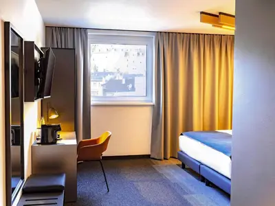 Ein Bett oder Betten in einem Zimmer der Unterkunft B&B Hotel München City-Nord