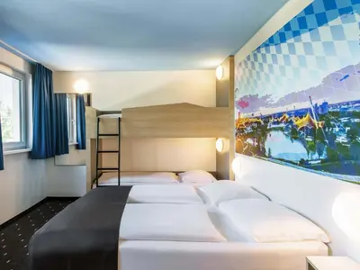 Ein Bett oder Betten in einem Zimmer der Unterkunft B&B Hotel München City-Nord