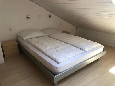 Ein Bett oder Betten in einem Zimmer der Unterkunft Ferienwohnung Nimscholz