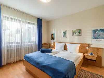 Ein Bett oder Betten in einem Zimmer der Unterkunft Ferienwohnanlage Oberaudorf D3 mit Hallenbad und Sauna
