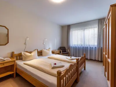 Ein Bett oder Betten in einem Zimmer der Unterkunft Ferienwohnanlage Oberaudorf C5 mit 5 Schlafplätzen und Hallenbad, Sauna