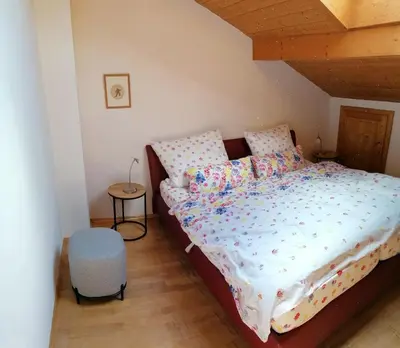 Ein Bett oder Betten in einem Zimmer der Unterkunft Ferienwohnung Sam