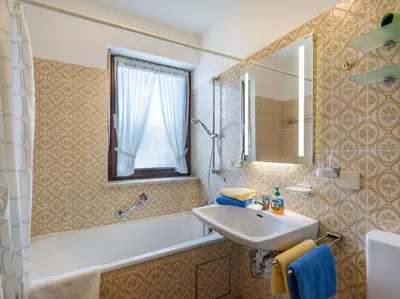 Ein Badezimmer in der Unterkunft Ferienwohnanlage Oberaudorf C4 mit Hallenbad und Sauna