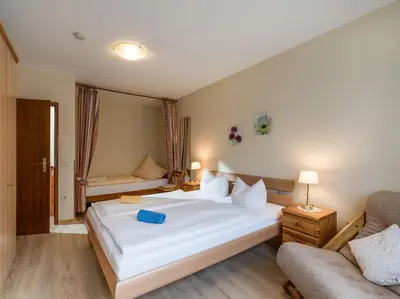 Ein Bett oder Betten in einem Zimmer der Unterkunft Ferienwohnanlage Oberaudorf C 2 mit Hallenbad und Sauna