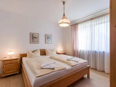 Ein Bett oder Betten in einem Zimmer der Unterkunft Ferienwohnanlage-Oberaudorf C 1mit Hallenbad und Sauna