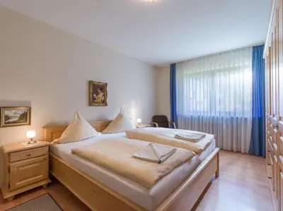 Ein Bett oder Betten in einem Zimmer der Unterkunft Ferienwohnanlage Oberaudorf D 2 mit Hallenbad und Sauna