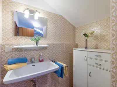 Ein Badezimmer in der Unterkunft Ferienwohnanlage Oberaudorf F8 mit Hallenbad und Sauna