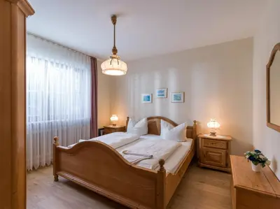 Ein Bett oder Betten in einem Zimmer der Unterkunft Ferienwohnanlage Oberaudorf F6 mit Hallenbad und Sauna