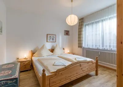 Ein Bett oder Betten in einem Zimmer der Unterkunft Ferienwohnanlage Oberaudorf E1 mit Hallenbad und Sauna