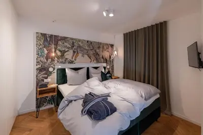 Ein Bett oder Betten in einem Zimmer der Unterkunft Ferienwohnung PARADIES am Tegernsee