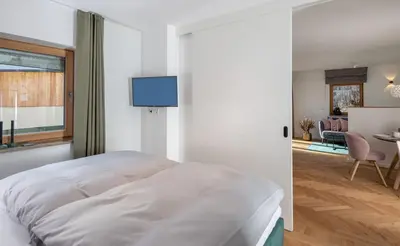 Ein Bett oder Betten in einem Zimmer der Unterkunft Ferienwohnung PARADIES am Tegernsee