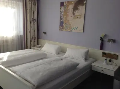 Ein Bett oder Betten in einem Zimmer der Unterkunft Gästehaus Margarete