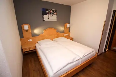 Ein Bett oder Betten in einem Zimmer der Unterkunft Hotel Heigl