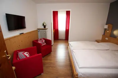 Ein Bett oder Betten in einem Zimmer der Unterkunft Hotel Heigl