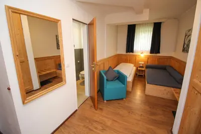 Ein Sitzbereich in der Unterkunft Hotel Heigl