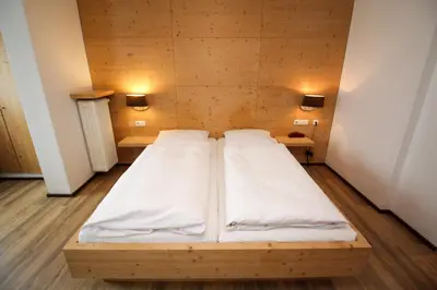 Ein Bett oder Betten in einem Zimmer der Unterkunft Hotel Heigl