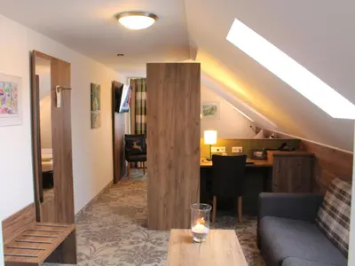 Ein Sitzbereich in der Unterkunft Hotel Häußler