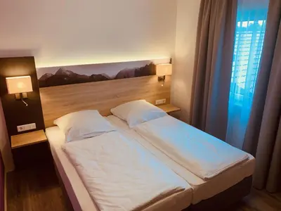 Ein Bett oder Betten in einem Zimmer der Unterkunft Pension Lindenhof
