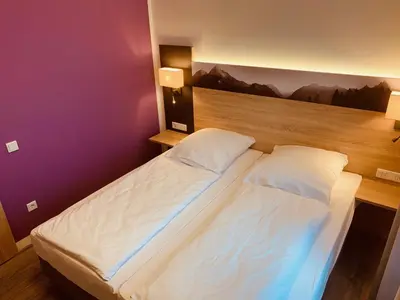 Ein Bett oder Betten in einem Zimmer der Unterkunft Pension Lindenhof