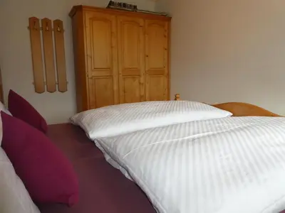 Ein Bett oder Betten in einem Zimmer der Unterkunft Gästehaus Bergblick